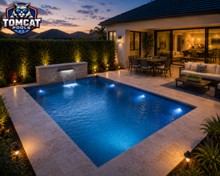 Rectangular pool with sheer-descent waterfalls and LED lighting by Tomcat Pools